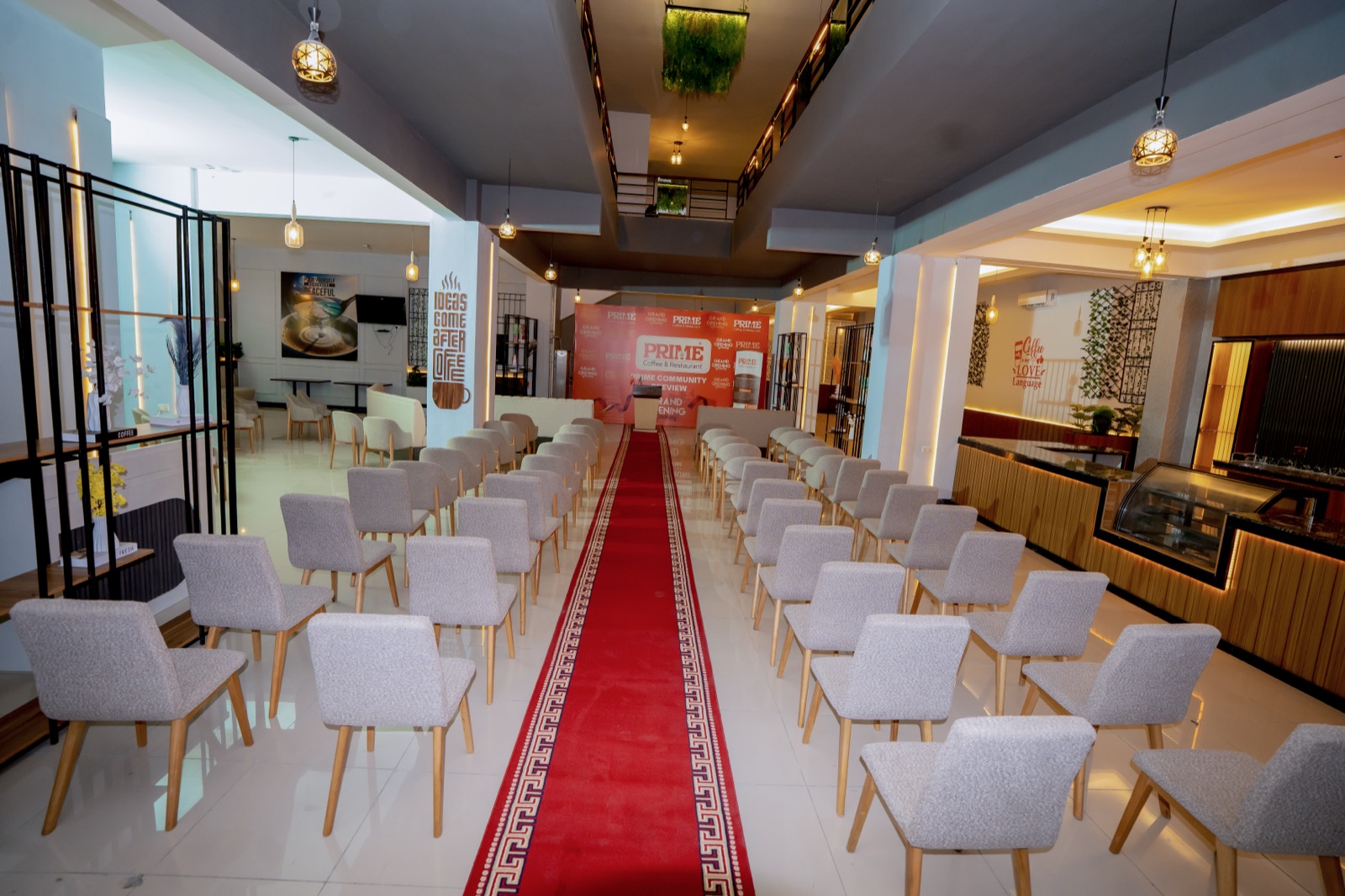 The Prime hall set for the Community Preview, with a red carpet and the coffee bar on the right