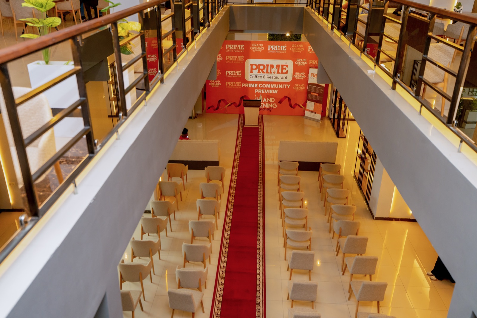 The Community Preview hall seen from the balcony, with the Prime Grand Opening banner